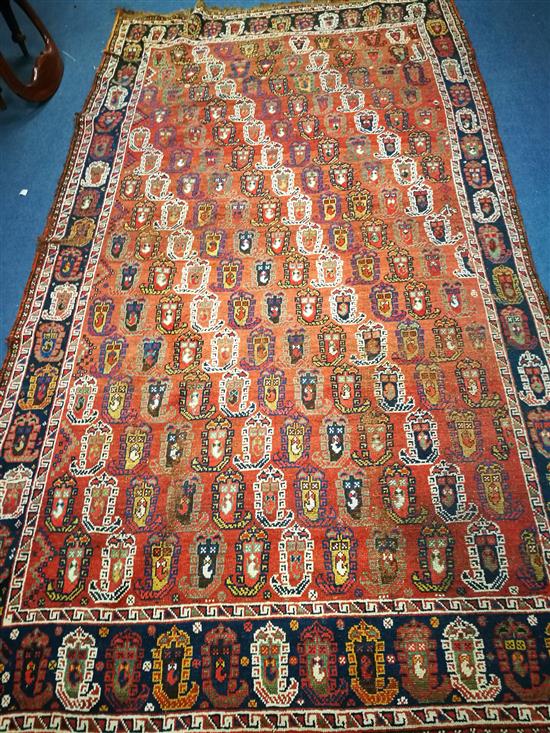 A Caucasian brick red ground Boteh rug 285 x 157cm